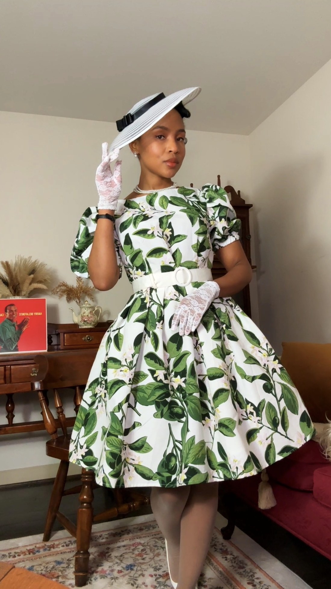 Green leaf-print dress and wide-brim hat