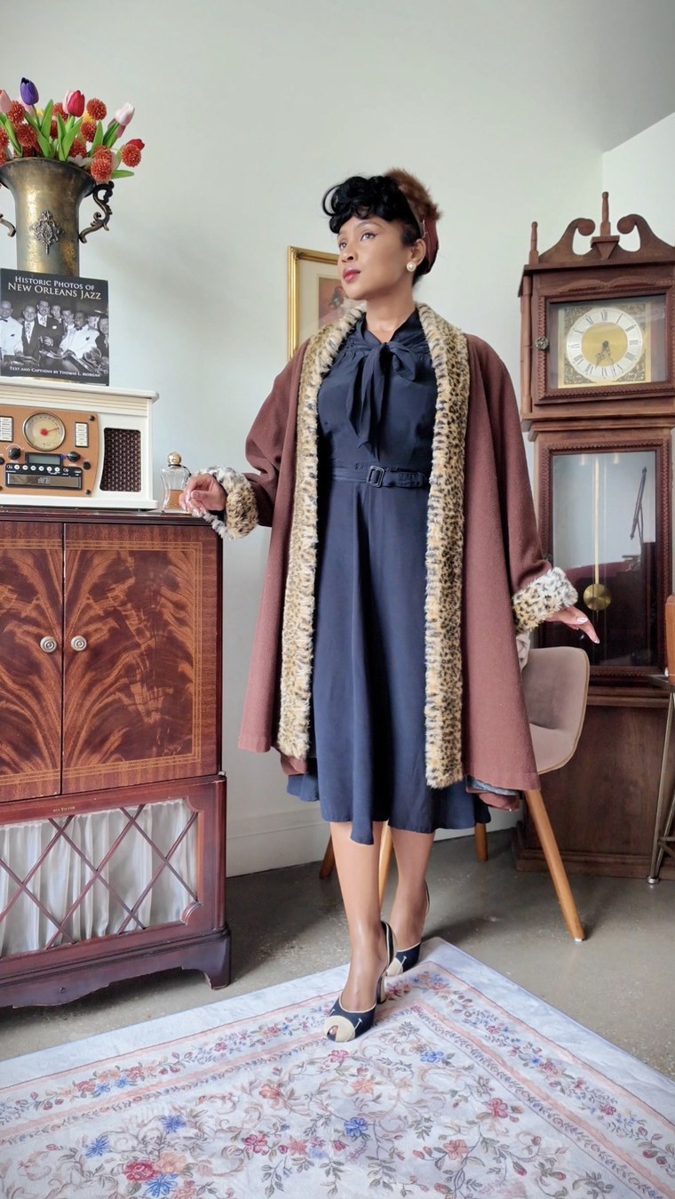 Navy dress with a leopard-trim coat